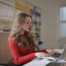 focused woman working using laptop