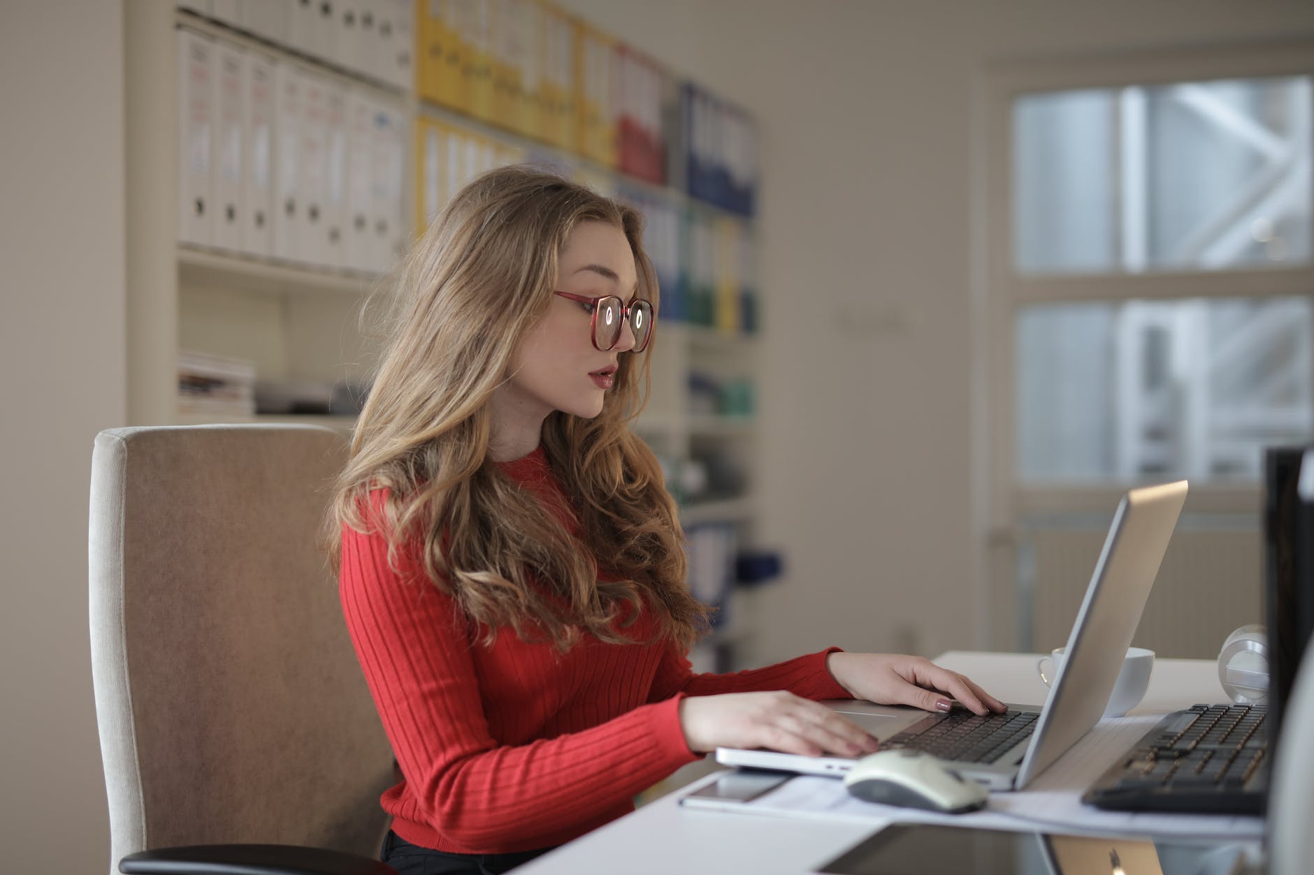 focused woman working using laptop